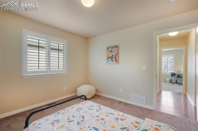 bedroom with light carpet