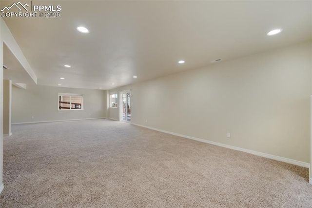 unfurnished living room featuring light carpet