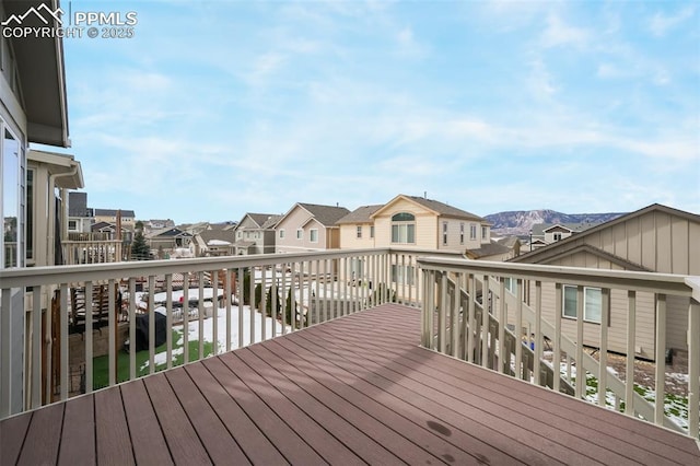 wooden deck featuring a mountain view