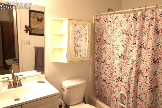 full bathroom with vanity, toilet, and shower / tub combo with curtain