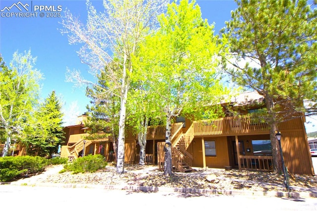 view of front of property featuring a wooden deck