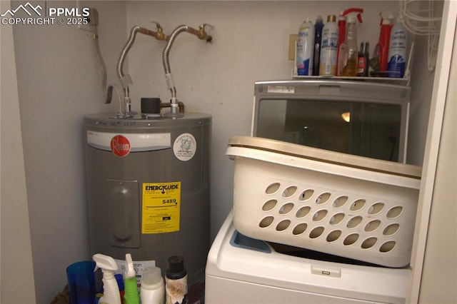 utility room featuring washer / clothes dryer and electric water heater