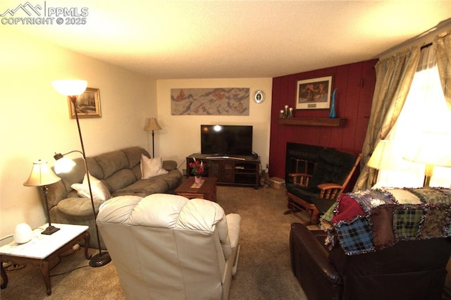 living room with a fireplace with raised hearth and carpet flooring