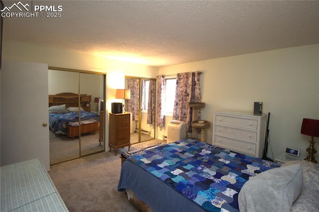 bedroom featuring a closet, a textured ceiling, and carpet