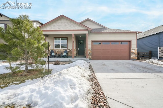 view of front of home with a garage and covered porch