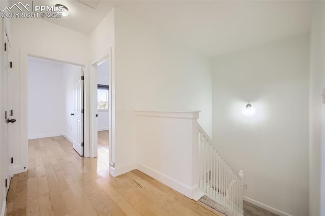 hallway with light wood-type flooring