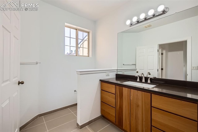 bathroom featuring tile patterned floors and vanity