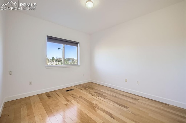 unfurnished room featuring light wood-type flooring