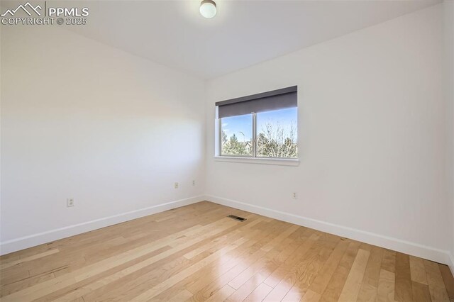 unfurnished room featuring light hardwood / wood-style floors