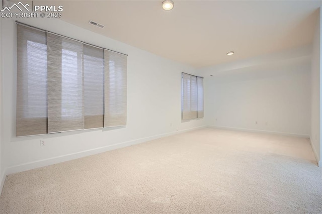 unfurnished room with carpet flooring