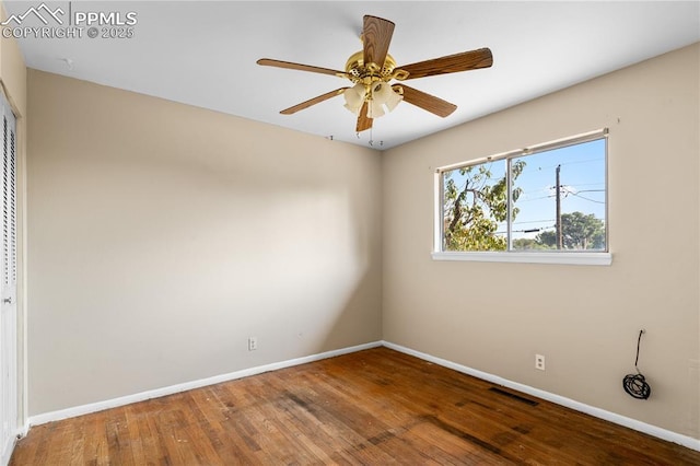 unfurnished room with hardwood / wood-style floors and ceiling fan