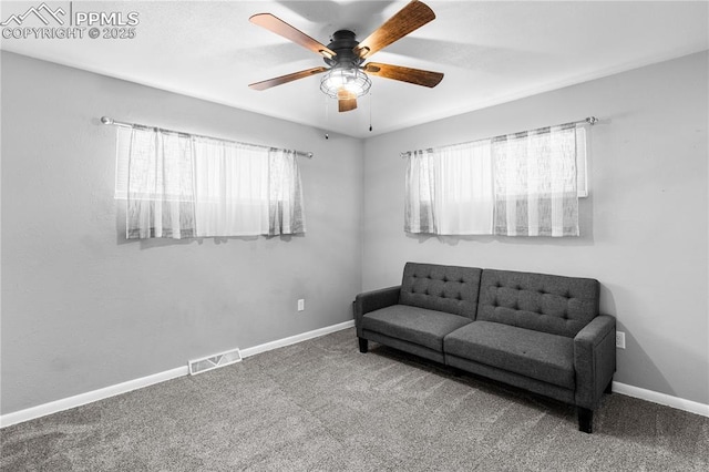 sitting room with carpet floors and ceiling fan