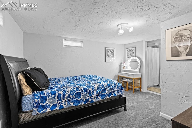 bedroom with carpet and a textured ceiling