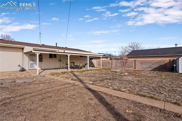 rear view of property with a patio