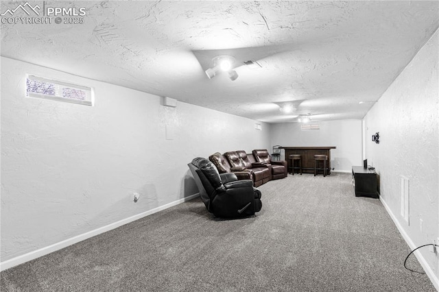 living room with indoor bar, a textured ceiling, and carpet flooring