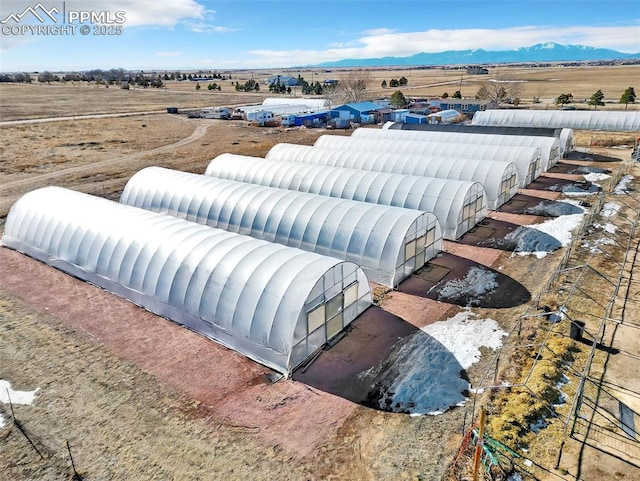 drone / aerial view featuring a mountain view