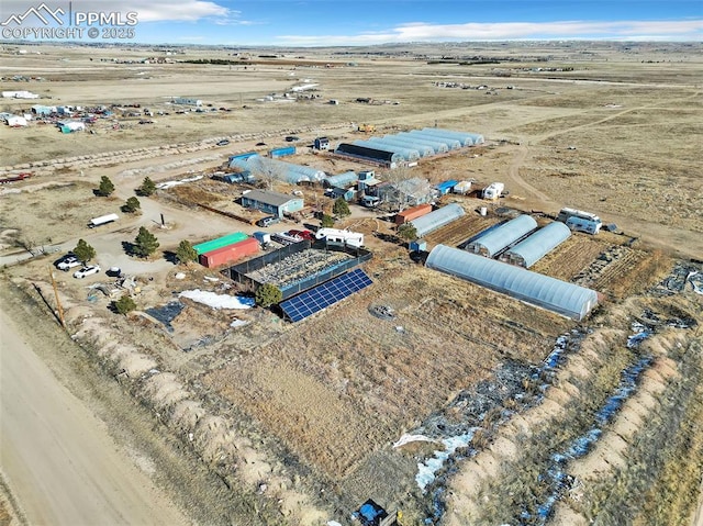 birds eye view of property with view of desert