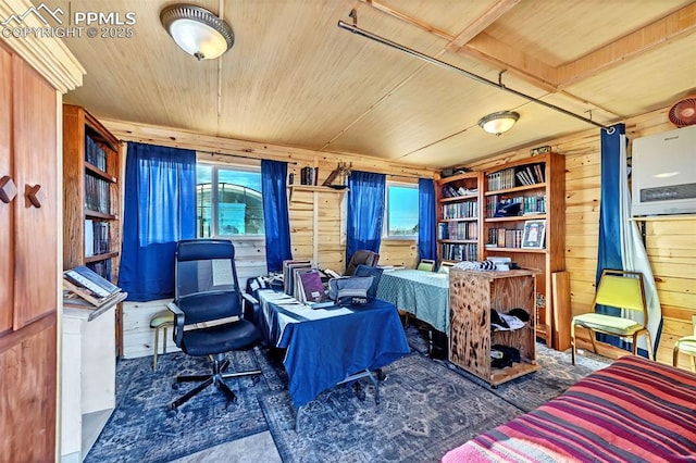 home office with wood ceiling and wooden walls