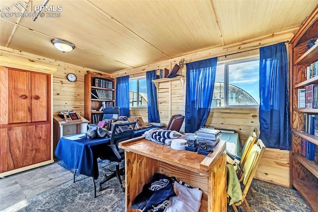 office area with wood walls, wood ceiling, and plenty of natural light