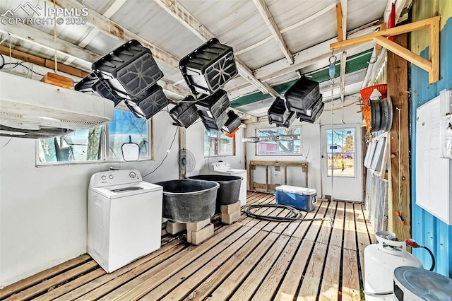 laundry room featuring laundry area, washer / clothes dryer, and a wealth of natural light