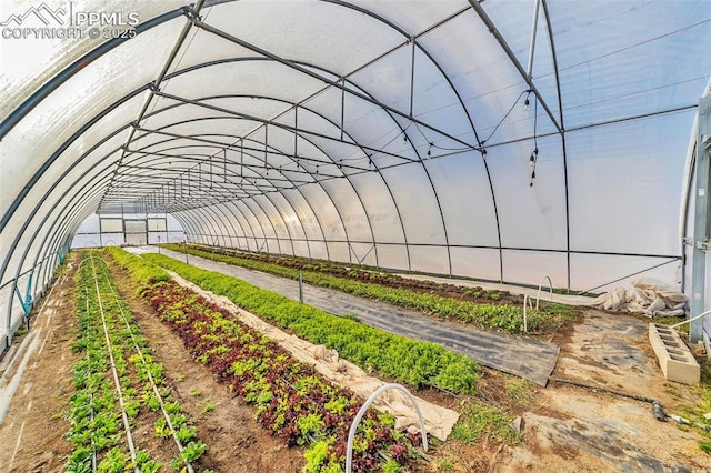 exterior space with a vegetable garden and a rural view