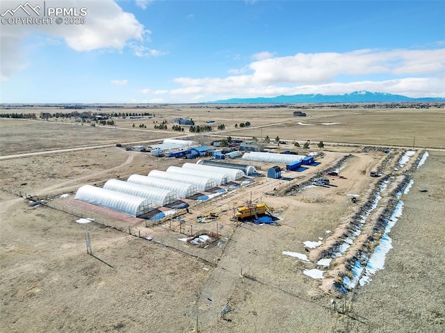 birds eye view of property with a rural view