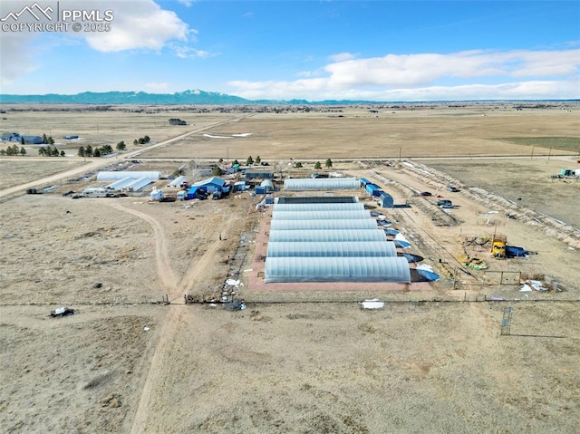 birds eye view of property featuring a rural view and a mountain view