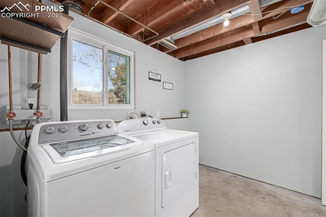 laundry area with washing machine and clothes dryer