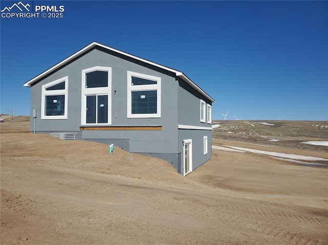 exterior space featuring stucco siding