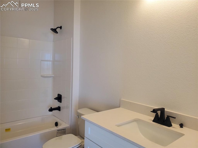 bathroom featuring tub / shower combination, vanity, and toilet