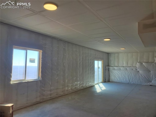 unfurnished room featuring concrete floors