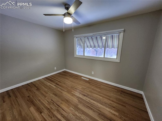 empty room with wood-type flooring and ceiling fan