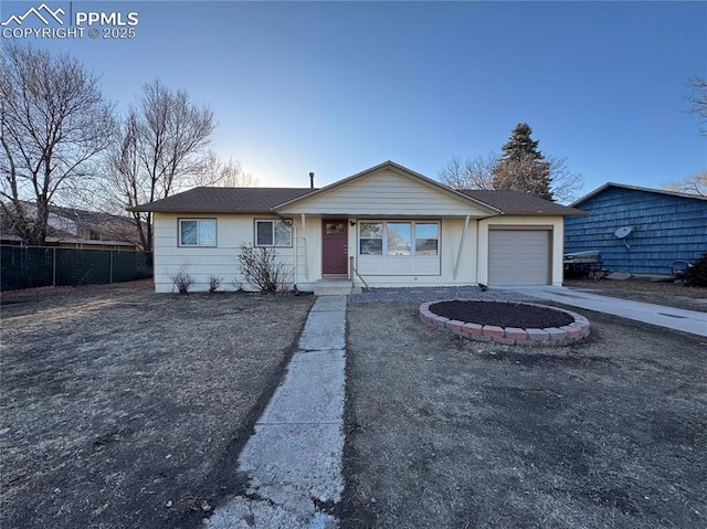 single story home featuring a garage