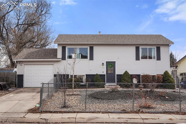 split foyer home featuring a garage