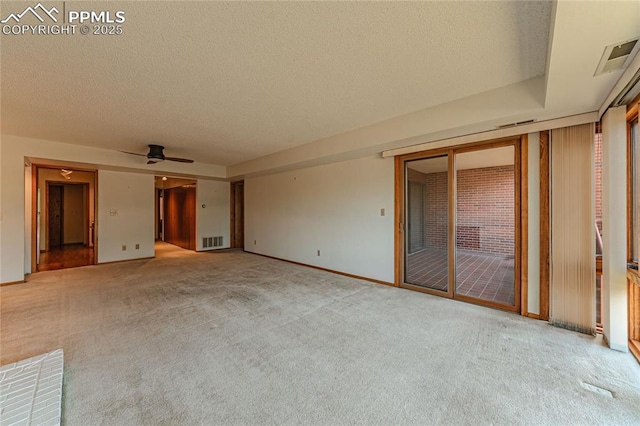 interior space with carpet floors, access to outside, and a textured ceiling