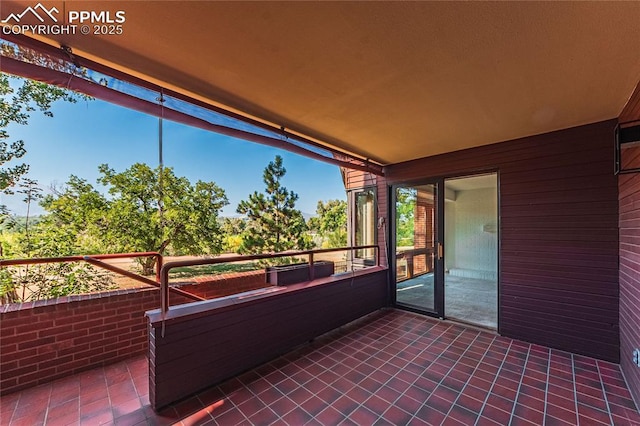 view of patio featuring a balcony