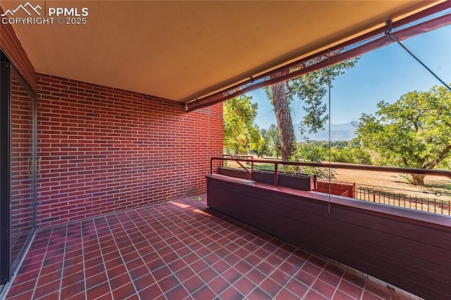 view of patio / terrace with a balcony