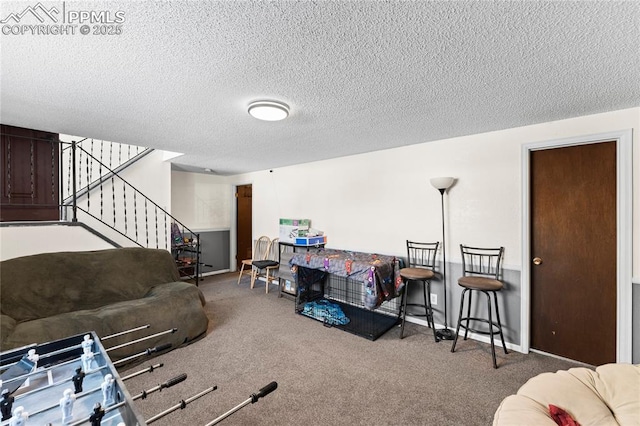 living room featuring carpet flooring and a textured ceiling