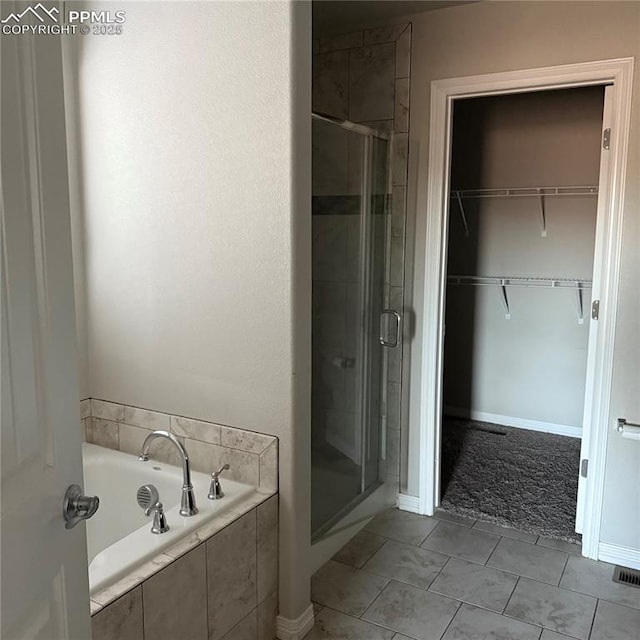 bathroom featuring separate shower and tub and tile patterned floors