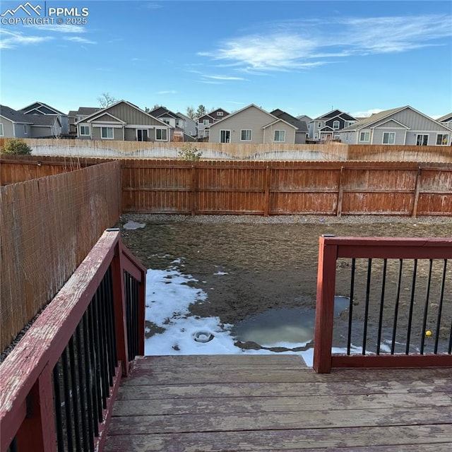 yard layered in snow featuring a wooden deck