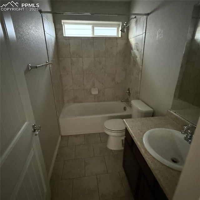 full bathroom with tiled shower / bath, vanity, toilet, and tile patterned flooring