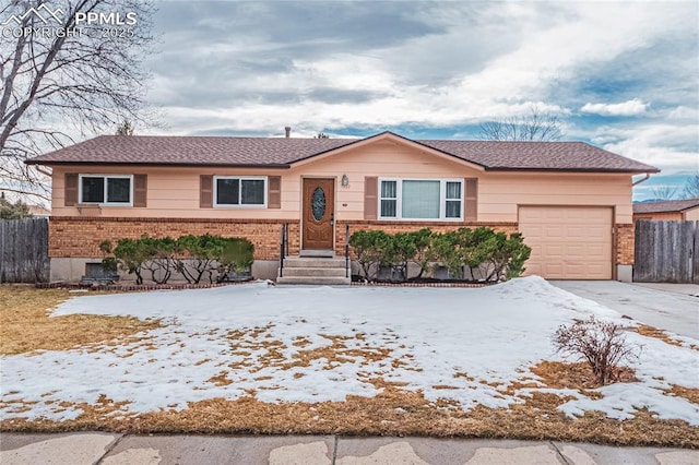 single story home featuring a garage