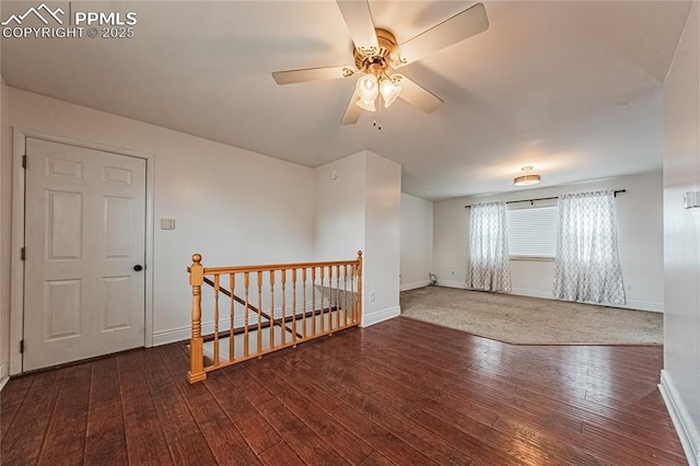 unfurnished room with ceiling fan and dark hardwood / wood-style floors