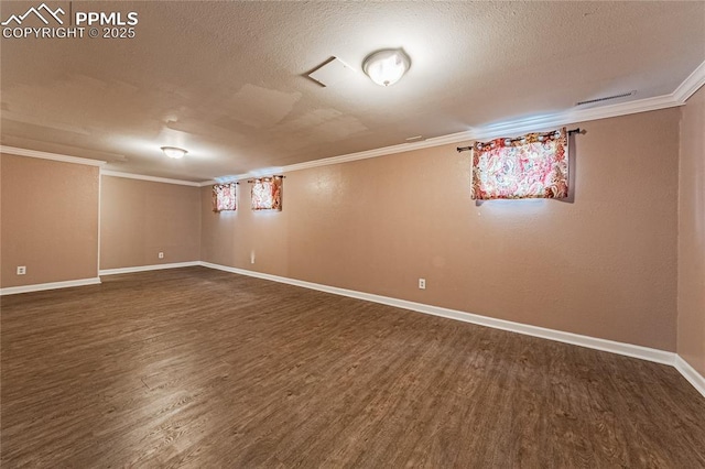 basement featuring crown molding, dark hardwood / wood-style flooring, and a textured ceiling