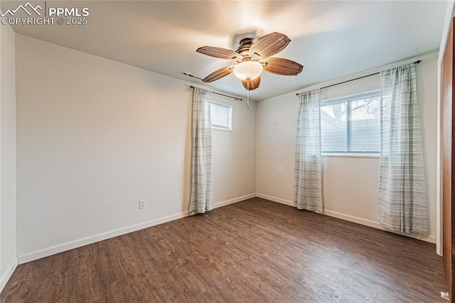 empty room featuring hardwood / wood-style flooring and ceiling fan