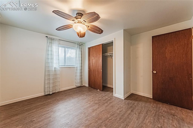 unfurnished bedroom featuring ceiling fan, dark hardwood / wood-style floors, and a closet