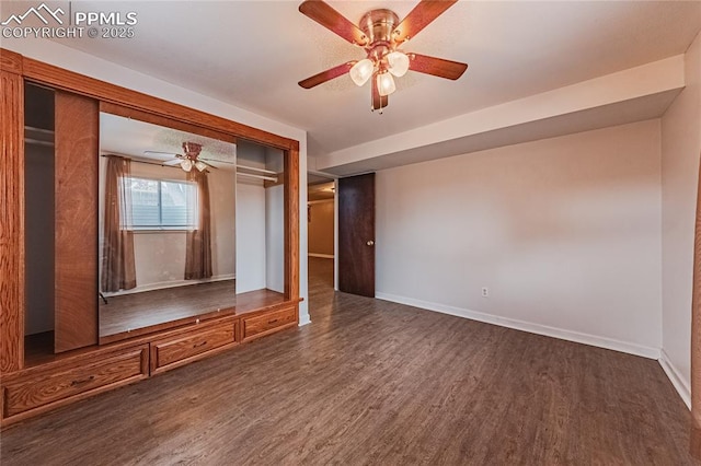 interior space featuring ceiling fan and dark hardwood / wood-style flooring