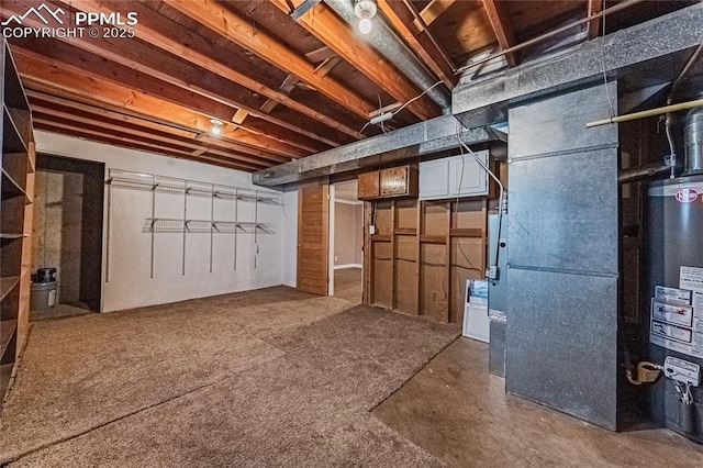 basement with gas water heater and heating unit