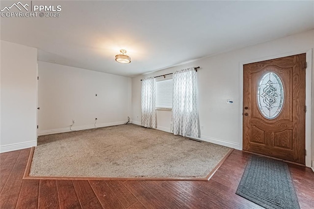 entrance foyer with dark hardwood / wood-style flooring