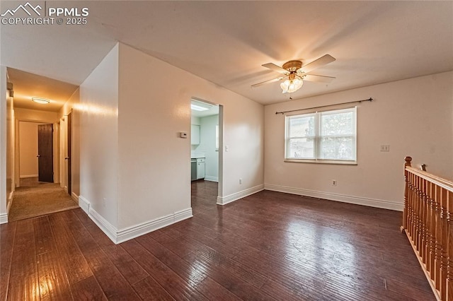 spare room featuring ceiling fan and dark hardwood / wood-style flooring